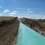 Oil and gas pipeline mid-construction on right of way (ROW).