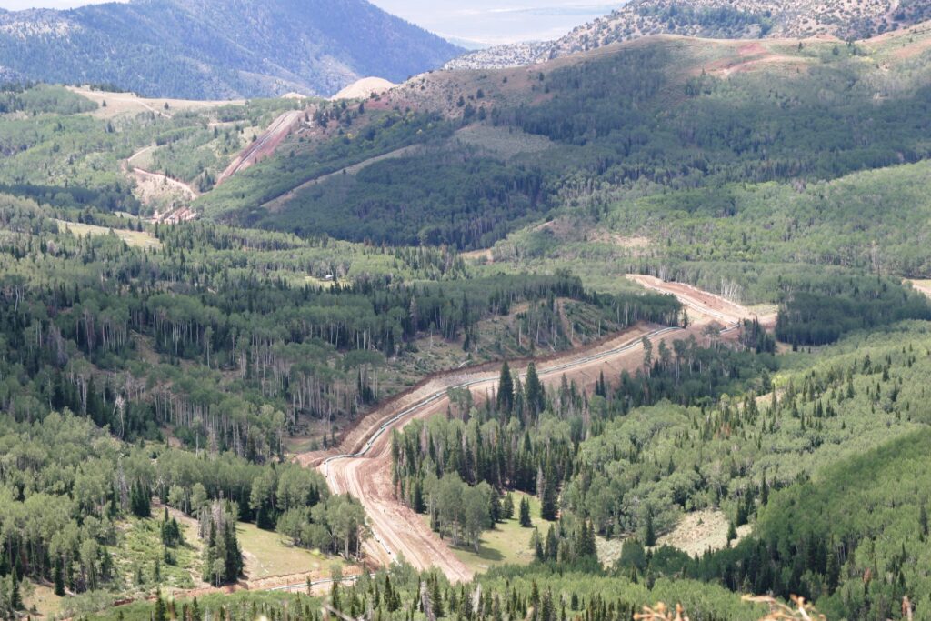 Pipeline construction right of way through mountains.