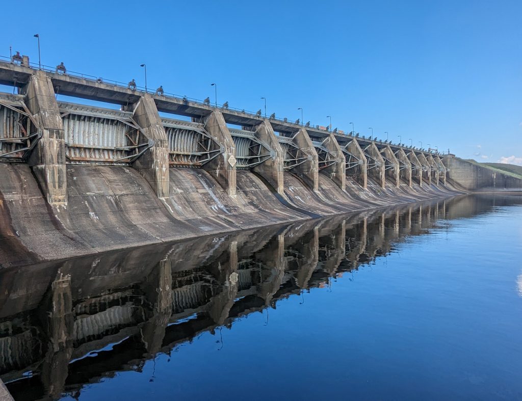 Tainter gated spillway at a hydro electric dam on the Wisconsin River in the midwestern United States. Photo taken by Eleanor Bloom geotechnical hydro engineer with Merjent, Inc.